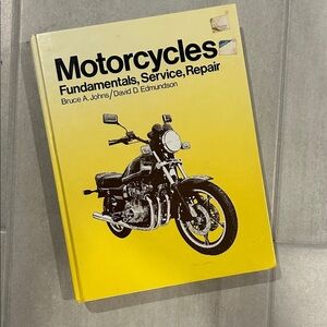 Yellow Motorcycle Repair Book